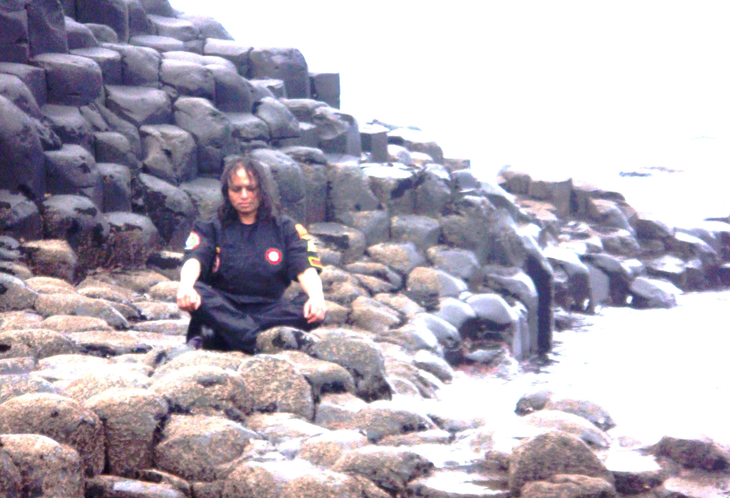 Vajramunee meditating on the basalt columns by the sea