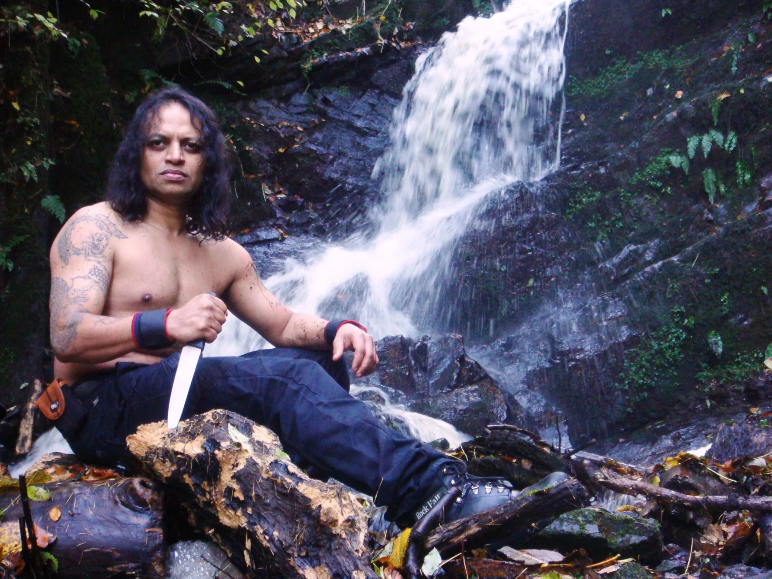 Vajramunee training beneath a waterfall