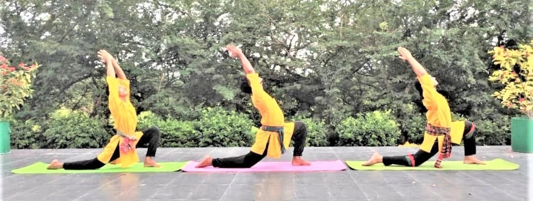 Group practising Vajrapran dharons outdoors